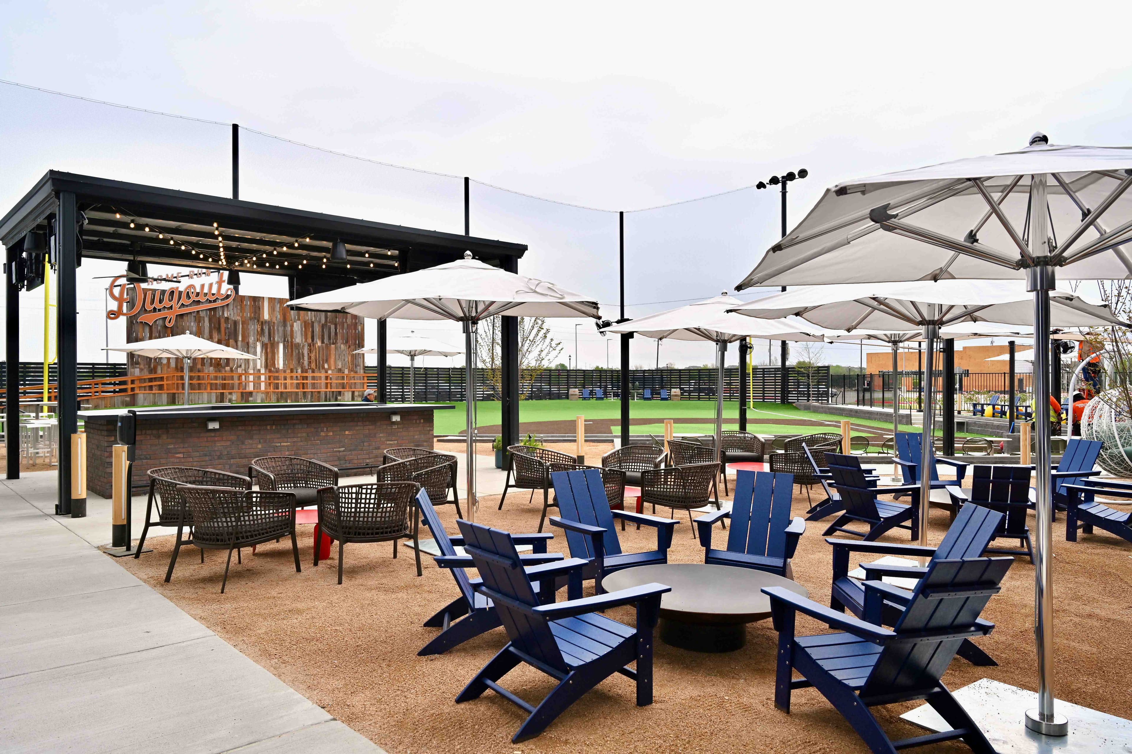 The beer garden, TVs, and big screen at Home Run Dugout in Katy, TX